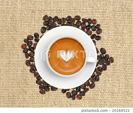 Latte coffee with heart symbol on linen texture Latte coffee with heart symbol on linen texture 20168522