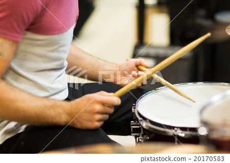 close up of musician with drumsticks playing drums close up of musician with drumsticks playing drums 20170583