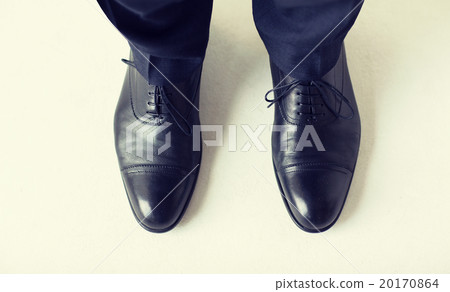 close up of man legs in elegant shoes with laces close up of man legs in elegant shoes with laces 20170864