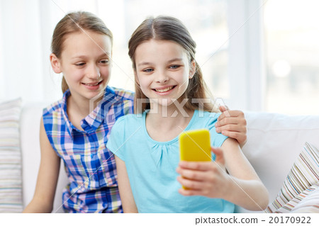 happy girls with smartphone taking selfie at home 20170922