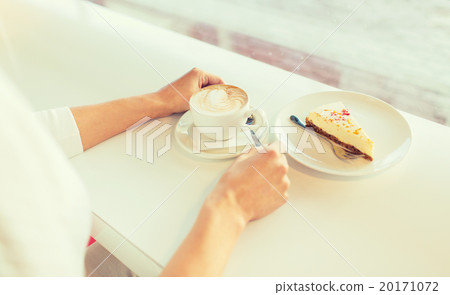 close up of woman hands with cake and coffee 20171072