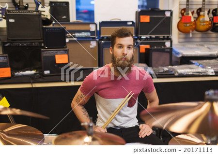male musician with cymbals at music store 20171113