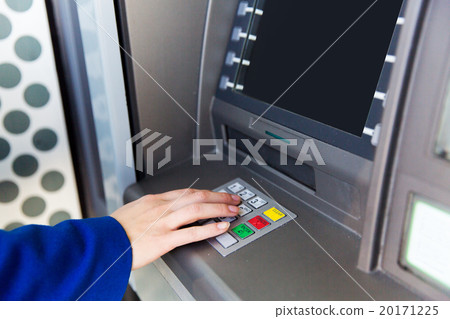 close up of hand entering pin code at cash machine 20171225