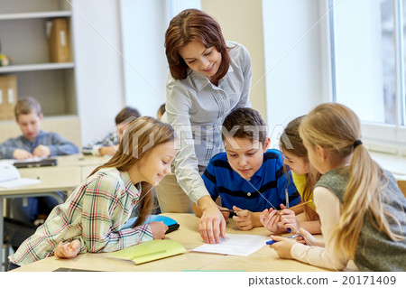 group of school kids writing test in classroom group of school kids writing test in classroom 20171409