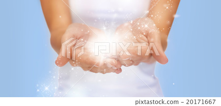 magic twinkles or fairy dust on female hands 20171667