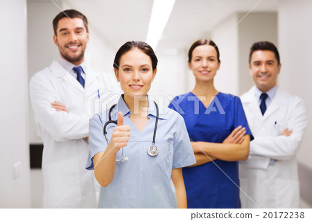 medics or doctors at hospital showing thumbs up 20172238