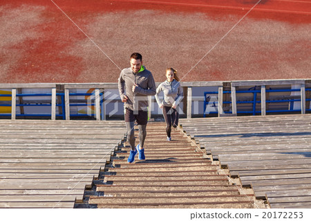 happy couple running upstairs on stadium happy couple running upstairs on stadium 20172253
