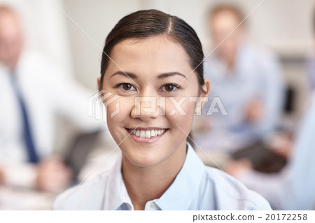 group of smiling businesspeople meeting in office group of smiling businesspeople meeting in office 20172258
