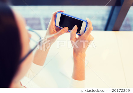 close up of woman with smartphone at office close up of woman with smartphone at office 20172269