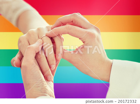 close up of lesbian couple hands with wedding ring 20172332