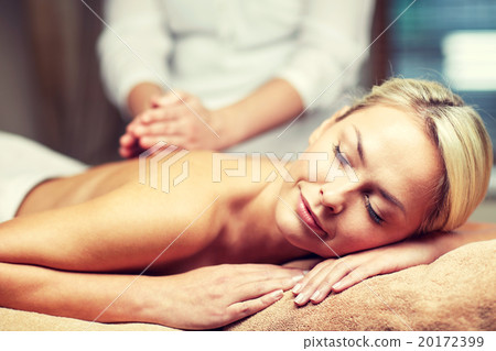 close up of woman lying and having massage in spa 20172399