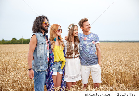 smiling young hippie friends on cereal field smiling young hippie friends on cereal field 20172483