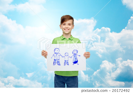 happy boy holding drawing or picture of family happy boy holding drawing or picture of family 20172492
