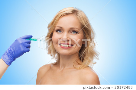 happy woman face and beautician hand with syringe happy woman face and beautician hand with syringe 20172493