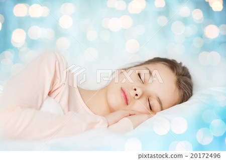 girl sleeping in bed over blue lights background girl sleeping in bed over blue lights background 20172496
