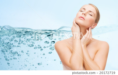 young woman touching her neck 20172719