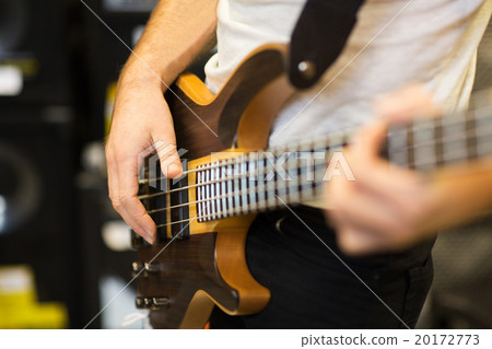 close up of musician with guitar at music studio close up of musician with guitar at music studio 20172773