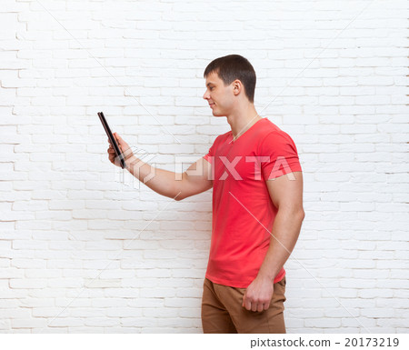 Casual Man Using Tablet Computer Social Network Casual Man Using Tablet Computer Social Network 20173219