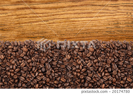 Close-up of roasted coffee beans over wooden 20174780