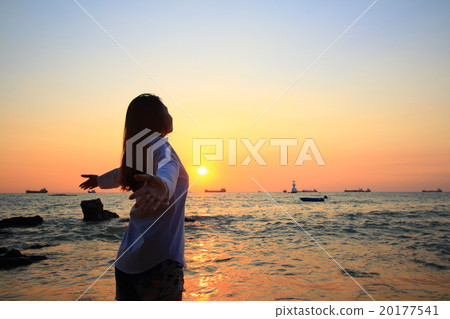 Enjoyment - free happy woman enjoying sunset 20177541