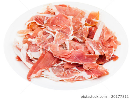 thin sliced uncooked jerked pork on plate isolated 20177811