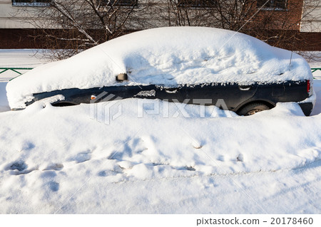 side view of black car covered with snow side view of black car covered with snow 20178460