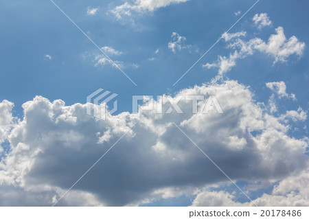 Beautiful light blue sky with puffy white clouds Beautiful light blue sky with puffy white clouds 20178486