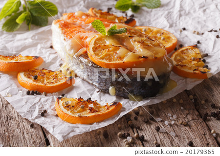 baked salmon steak with oranges on baking paper baked salmon steak with oranges on baking paper 20179365