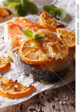 baked salmon steak with oranges closeup baked salmon steak with oranges closeup 20179367