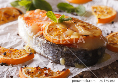 baked salmon steak with oranges closeup baked salmon steak with oranges closeup 20179368
