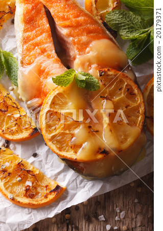 baked salmon steak with oranges close-up baked salmon steak with oranges close-up 20179371