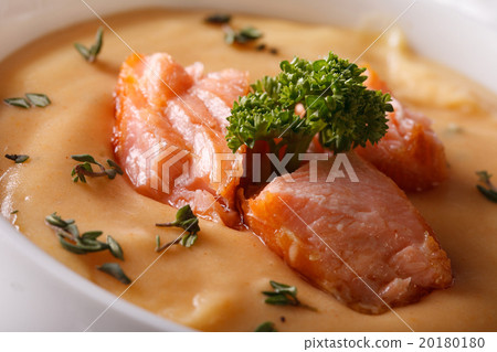 Thick soup puree of red fish macro in a bowl Thick soup puree of red fish macro in a bowl 20180180