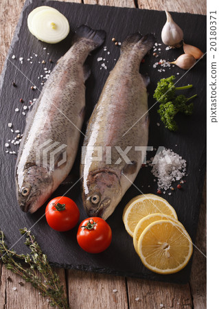 Two raw rainbow trout with ingredients Two raw rainbow trout with ingredients 20180371