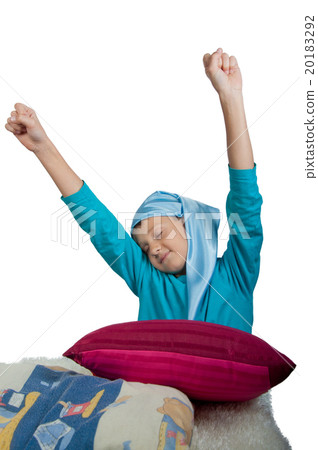 Cute boy near maroon pillow isolated 20183292