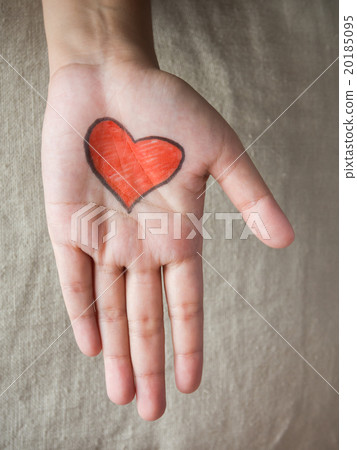 Hand with red heart shape Hand with red heart shape 20185095