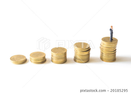 Businessman standing thinking on coins stacks. Businessman standing thinking on coins stacks. 20185295
