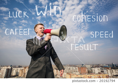 Businessman on the roof with megaphone Businessman on the roof with megaphone 20192794