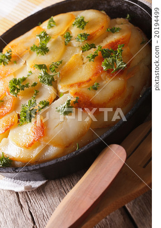 Delicious potato casserole in a pan close-up 20194499