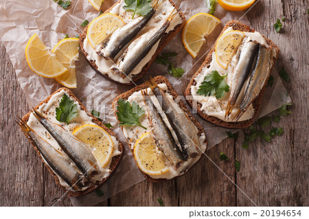 Sandwiches with sprats, cream cheese close-up 20194654