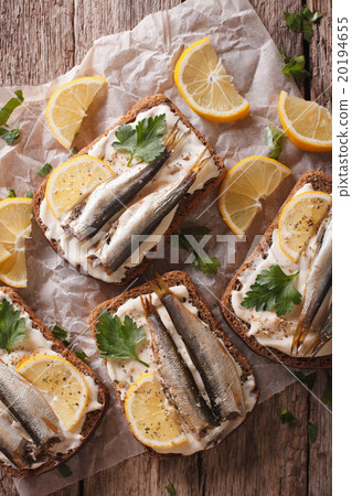 Sandwiches with sprats, cream cheese close-up 20194655