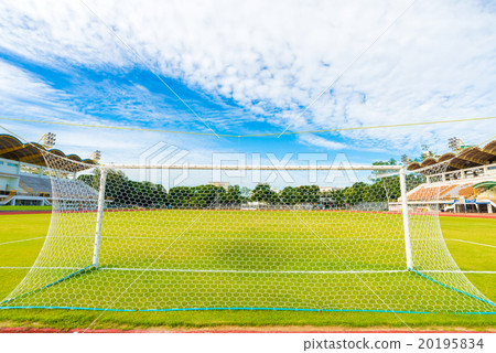 Football field with green grass at sunny day Football field with green grass at sunny day 20195834