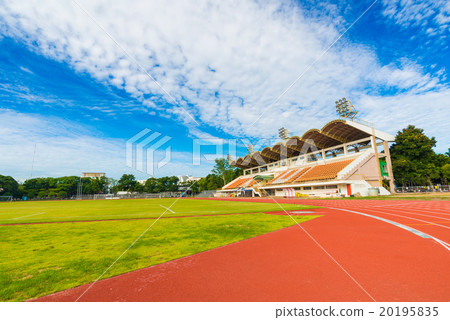 Football field with green grass at sunny day Football field with green grass at sunny day 20195835