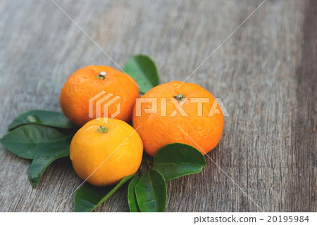 Organic orange on wooden board Organic orange on wooden board 20195984