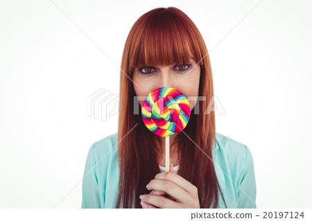 Smiling hipster woman with a lollipop 20197124