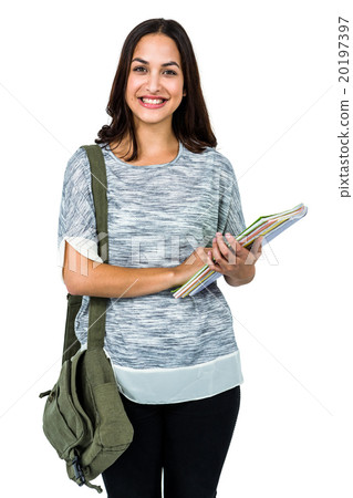 Portrait of smiling woman holding books 20197397