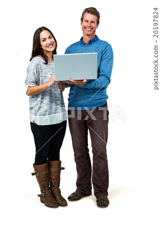 Portrait of smiling couple holding laptop 20197824