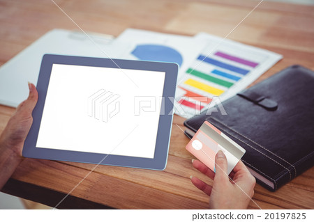 Over shoulder view of hipster woman using tablet 20197825