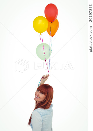 Smiling hipster woman holding balloons 20197858