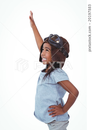 Side view of girl with outstretched arm pretending to be pilot 20197883