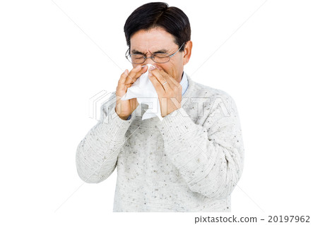 Smiling man using a tissue 20197962